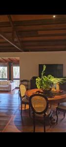 a living room with a table and chairs and a couch at Chateau Tiradentes in Tiradentes