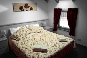 Cama o camas de una habitación en Hotel Al Bosco
