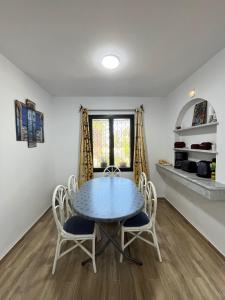 a dining room with a table and chairs at Marina Escape, 2BD, Pool and Beach in Hammam Sousse