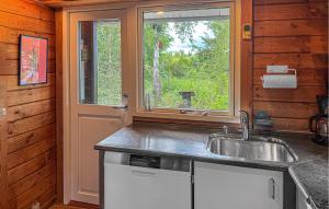 a kitchen with a sink and a window at Cozy Home In Ebeltoft With Wifi in Ebeltoft