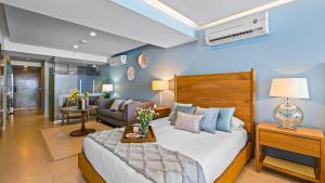 a bedroom with a bed and a living room at Gorgeous 1BR Condo with Pools & Sea Views in Puerto Vallarta +45 photos