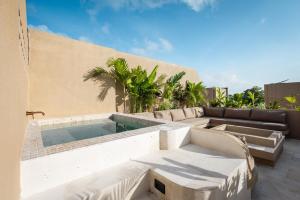 a swimming pool on the side of a building at SISI Wellness Villas in Bingin Beach