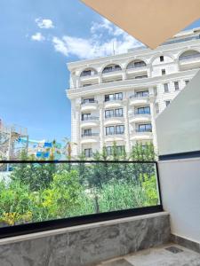 a view of a large white building from a window at Crown Villa in Golem