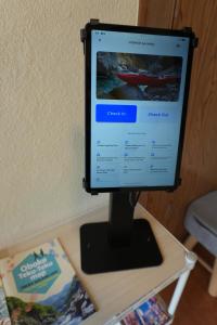 a computer monitor sitting on top of a table at COSMOS Iya Valley in Akano
