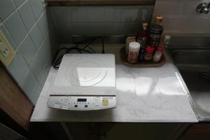 a washing machine sitting on a counter in a bathroom at COSMOS Iya Valley in Akano +25 photos