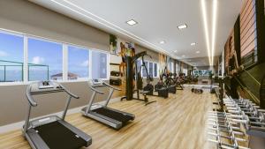a gym with treadmills and elliptical machines at Lar Luar do Sertão in Aracaju