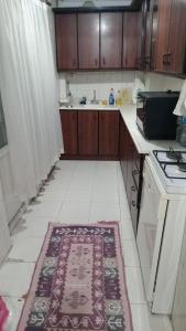 a kitchen with a rug on the floor at Huzur 30 in Edirne