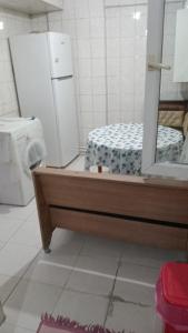 a kitchen with a refrigerator and a mirror at Huzur 30 in Edirne
