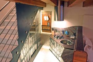 a bathroom with a sink and a staircase at Casa Carlo Goldoni in Venice