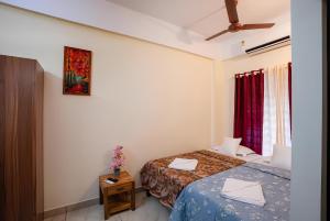 a hotel room with two beds and a window at Park View Residency - Guest House Near Sree Padmanabhaswamy Temple in Trivandrum