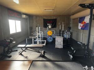 a gym with several equipment in a room at Private Stay EN SUMOTO in Sumoto