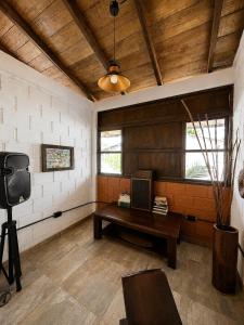 a room with a table and a tv in it at La Cabaña Mr Brown in Puerto Leguízamo +38 photos