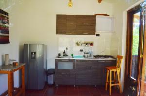 a kitchen with a sink and a refrigerator at San Pedro in Ráquira +5 photos