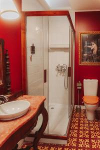 a bathroom with a shower and a sink and a toilet at Villa Luxa in Sintra