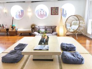 a living room with a couch and a table at Cipango - Hong Kong Houseboat in Hong Kong +43 photos
