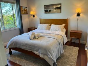 a bedroom with two beds and a window at Private bedroom and bathroom in Rancho Santa Margarita