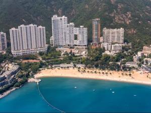 an aerial view of a beach with hotels and buildings at Cipango - Hong Kong Houseboat in Hong Kong