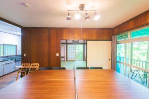 a large conference room with a large wooden table at Luminous Komoro in Komoro
