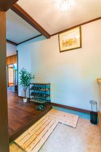 a room with a blue wall with a wooden floor at Luminous Komoro in Komoro +70 photos