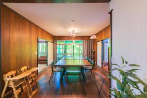 a dining room with a table and chairs at Luminous Komoro in Komoro