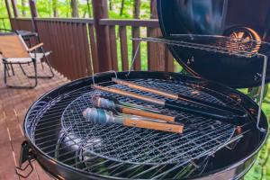 a grill with tongs and matches on it at Luminous Komoro in Komoro