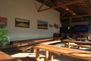 a group of wooden benches in a room at An Hải Beachfront Retreat Ninh Thuận in Thôn Dư Khánh +94 photos