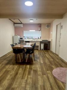 a dining room with a table and chairs in an office at Folk-ish Style 風 in Miyazu
