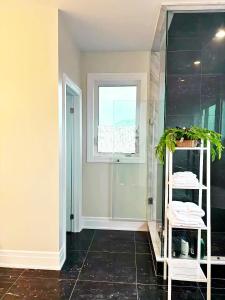 a bathroom with a walk in shower and a window at NEW Spacious BR with Ensuite Bathroom in Innisfil +30 photos