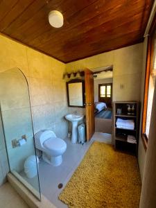 a bathroom with a toilet and a shower and a sink at Inka Tambo Hacienda in Cusco +121 photos