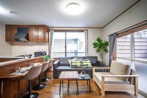 a living room with a couch and a table at 春日レジャーホテル in Fukuoka