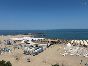 an aerial view of a beach with umbrellas and chairs at Sunny Apartment in Constanţa
