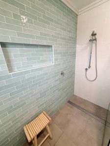 a bathroom with a brick wall and a shower at Arcos in Hat Head +14 photos