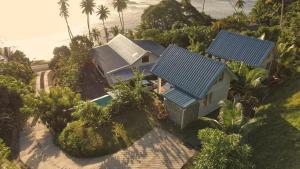 an aerial view of a house with solar panels on it at BougainVilla Savusavu in Savusavu