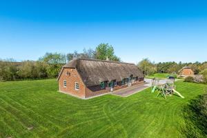 an aerial view of a barn with a grass field at Feriehus 2033 in Ulfborg