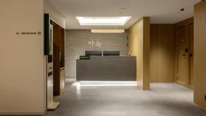 an office lobby with a reception desk in a building at Anook Hotel Ulsan Samsan in Ulsan