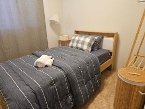 a bedroom with a bed with a stuffed animal on it at Balina-Blume in Kathu +20 photos