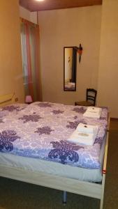 A bed or beds in a room at La Borgata