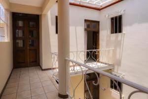 a balcony with a railing and a door at HOTEL NIUT-JA in Oaxaca City