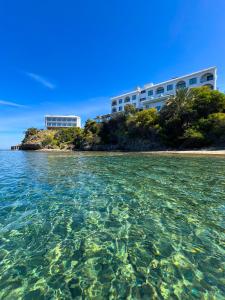 a view of a building from the water at E.J. Pyrgos Bay Hotel in Kato Pyrgos