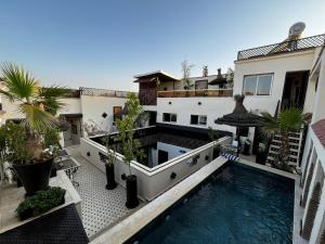 an aerial view of a house with a swimming pool at Dar Najat in Marrakesh