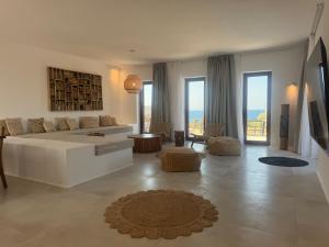 a large living room with a couch and a table at Antiparos Gems - The villa in Antiparos