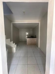 an empty hallway with a staircase in a house at Residencial js in Fortaleza