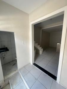 an empty bathroom with stairs in a room at Residencial js in Fortaleza