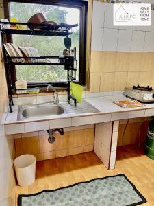 a kitchen counter with a sink and a window at Temple House by Julie PC in Ko Phangan +54 photos