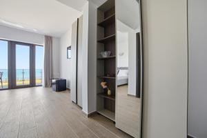 a corridor of a hotel room with a bedroom at InWaves in Vama Veche