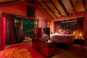 a bedroom with a bed and a large window at SAMA The Silver Creek in Bogmalo +37 photos