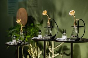 a group of three shelves with bottles of perfume at Oani in Taipei
