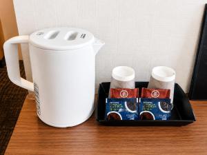 a table with a container of coffee and a blender at Floral Hotel Mari-Kyoto in Kyoto