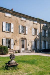 an old building with a statue in front of it at Château de La Sizeranne - Beausemblant in Beausemblant