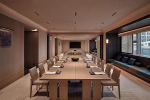 a long conference room with a long table and chairs at Alila Shanghai in Shanghai +106 photos